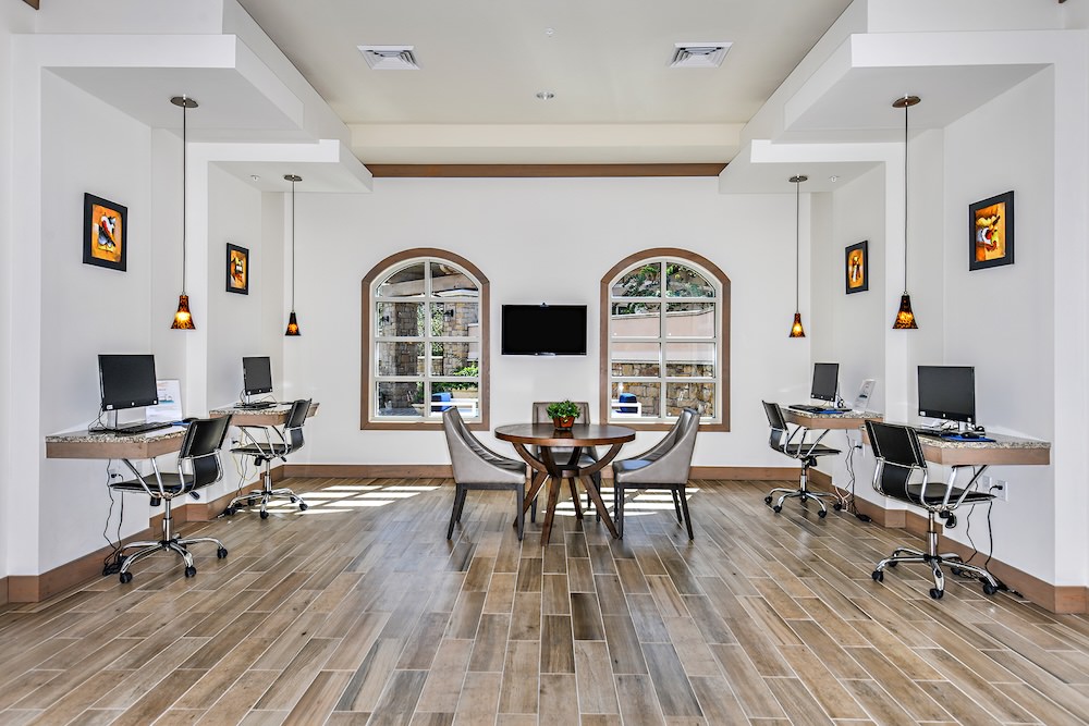 Access to resident-only features co-working area with computers seating and tables