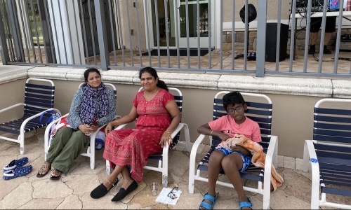 people sitting on lawn chairs