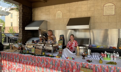 people behind a table serving food