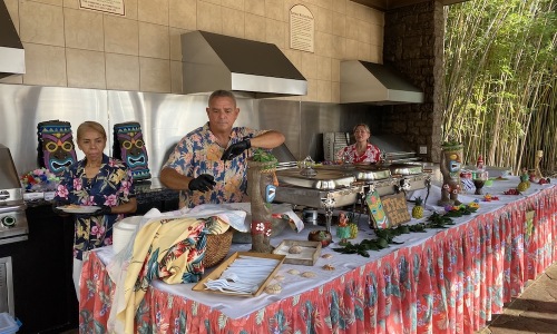 people behind a table serving food