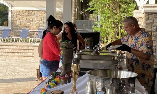 man serving people food