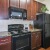 a kitchen with wooden cabinets