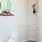 a walk in closet with wire shelves
