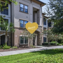 exterior of property showing green grass and wide sidewalks