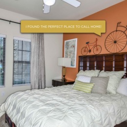 a bedroom with multiple windows