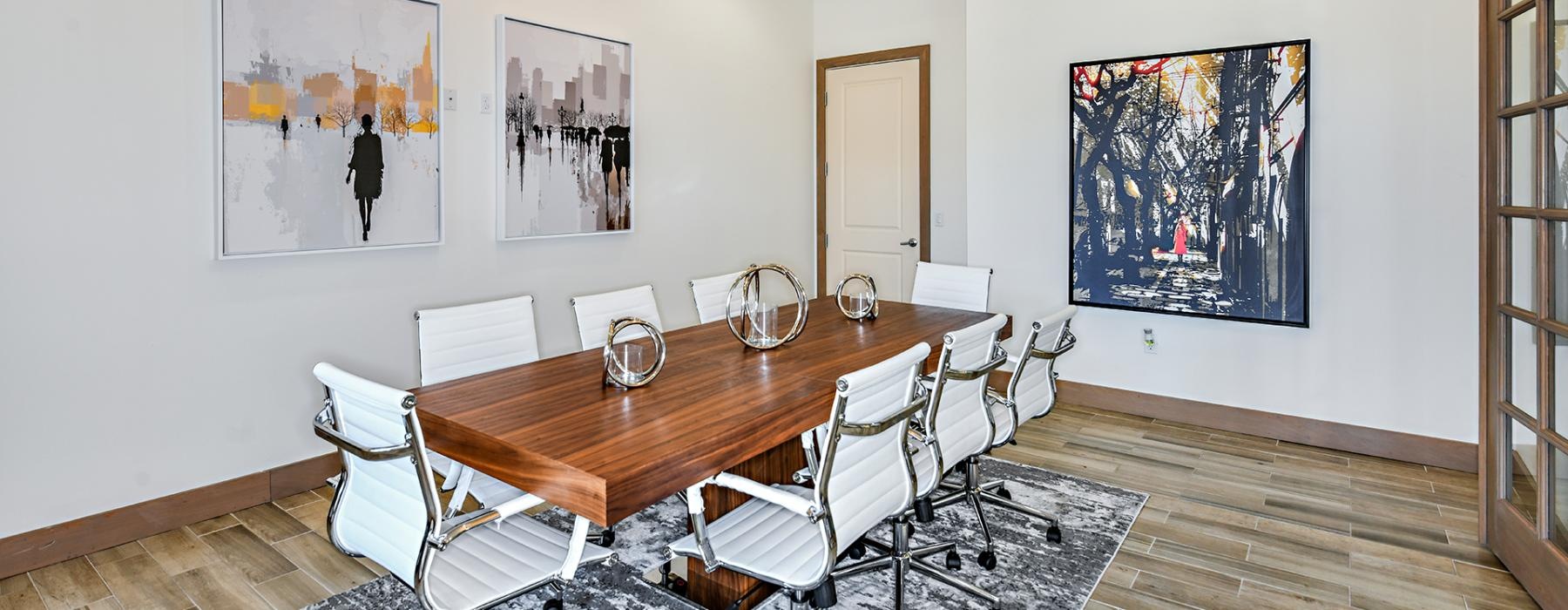 a dining room with a table and chairs